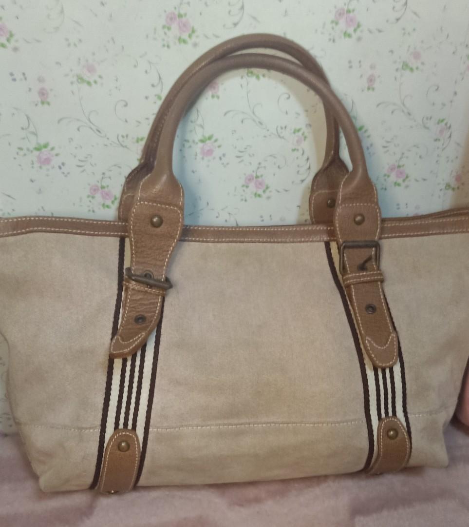 Burberry Blue Label Canvas Hand/Tote Bag (Category: Luxury Bags & Wallets) located in Caloocan City. Submitted by drum_beater (Listing ID 1130273483, Image 2). Description: Measurements:18x10x6 Large Size Thick Canvas/ Genuine Leather type brass hardwares YKK zipper engraved brand on rivets please see detailed pictures for the issues on both corners and inside as signs of usage Item is searchable online with white tag bought online at P3800+sf.