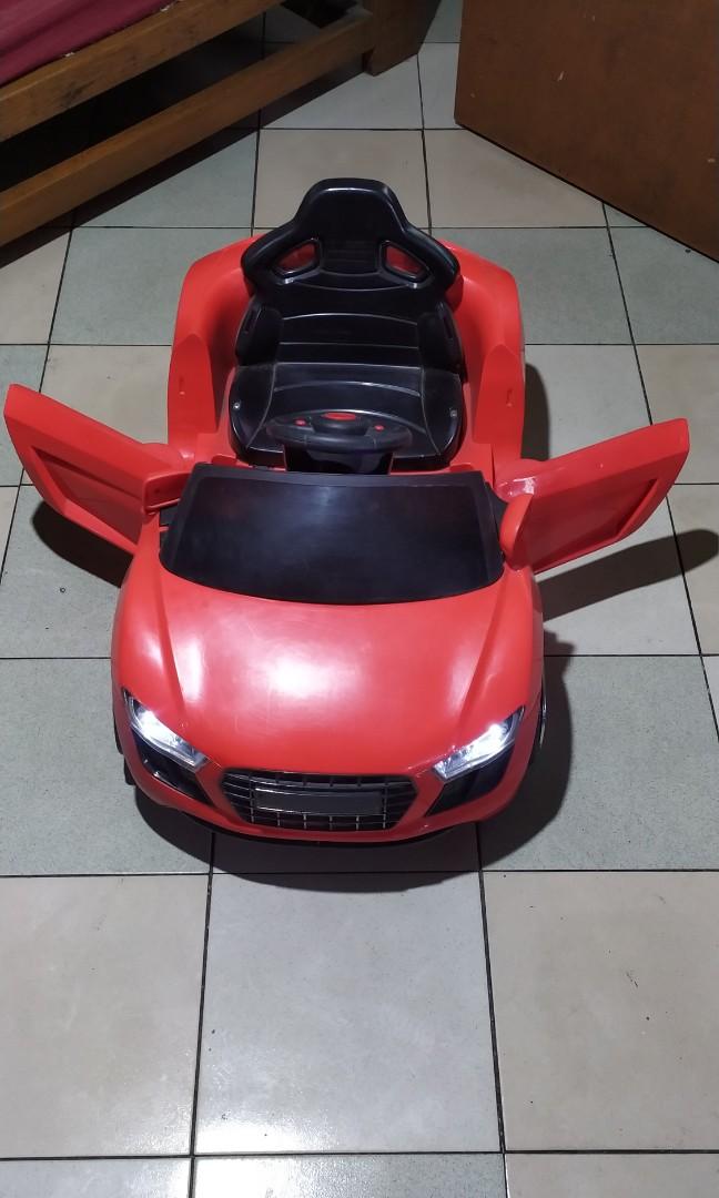 RED TOP DOWN RIDE ON CAR SOUNDS AND LIGHT WORKING IDEAL FOR 2 TO 3YRS ...