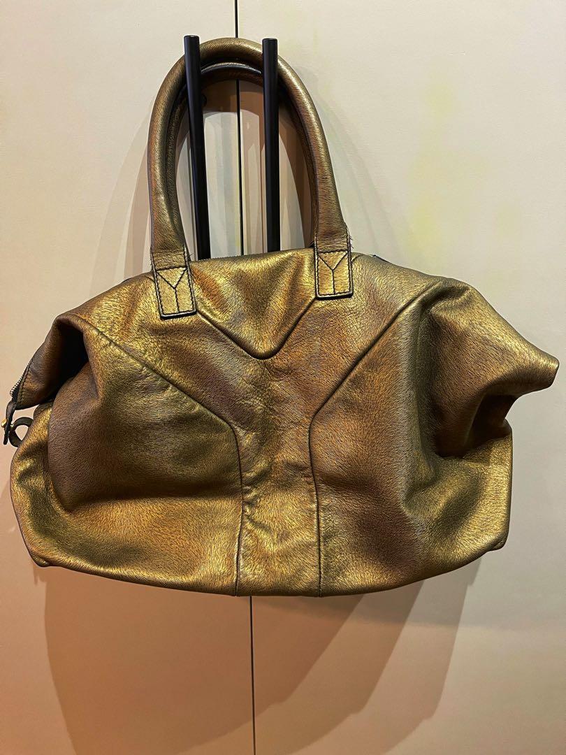 YSL Easy 2way tote, bronze feathered leather (Category: Luxury Bags & Wallets) located in Makati City. Submitted by betsybaking (Listing ID 1130288676, Image 2). Description: Bought in Rustans in 2014, used with care, basically in car and in office only. Good to carry your office stuff, laptop other gadgets and kikay kit. Or your weekend essentials. Can be carried as flat tote or tucked on the sides for a funkier look. .