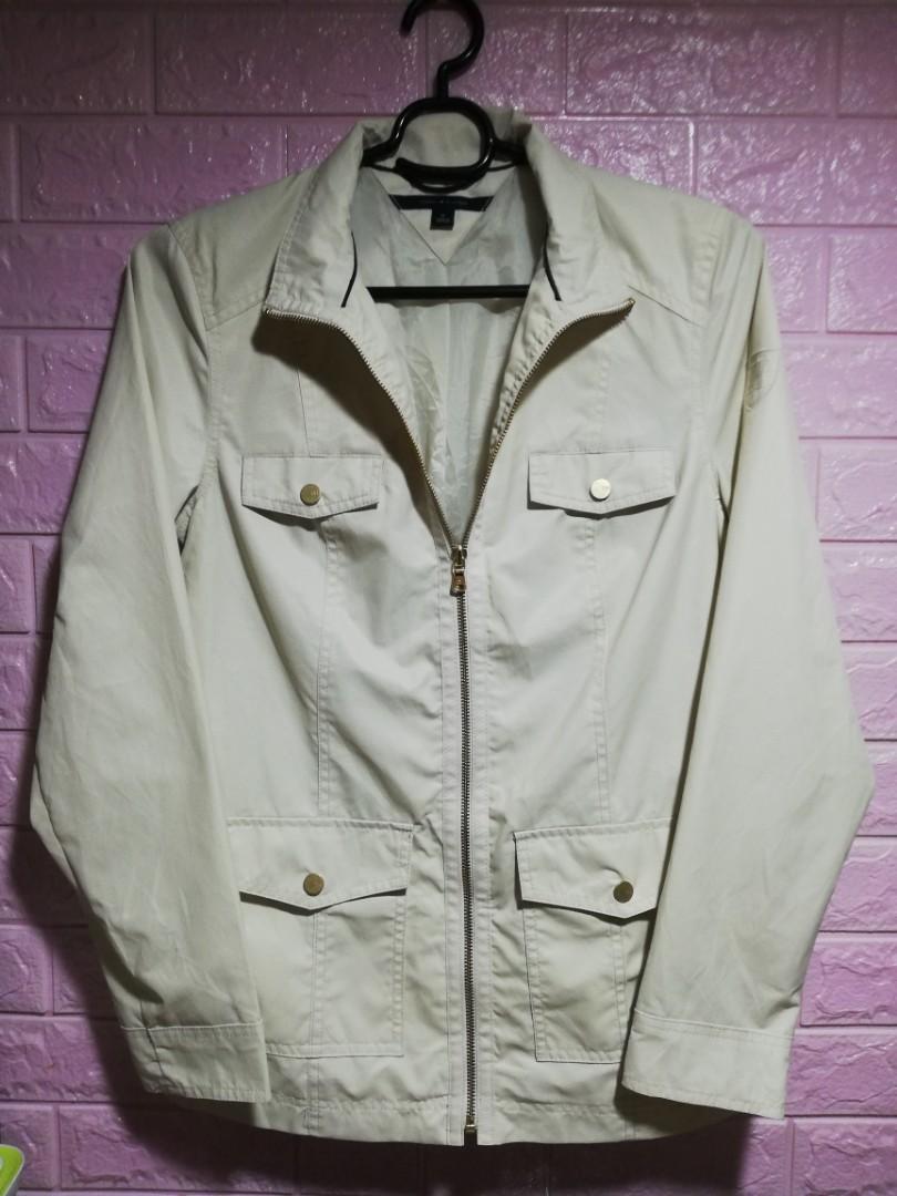 Tommy Hilfiger Windbreaker/Water Repellent (Category: Coats, Jackets and Outerwear) located in Quezon City. Submitted by drivenvf (Listing ID 1066764166, Image 1). Description: Medium Cream Color Water Repellent Light W19xL28 10/10 No Flaw Excellent Preloved.