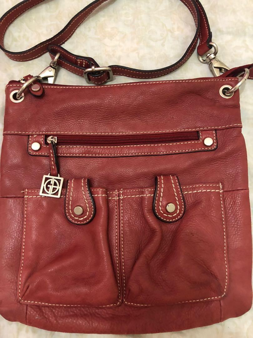 SALE!!! Authentic Giani Bernini Cross Body Bag (Category: Cross-body Bags) located in Bulacan. Submitted by le_verne (Listing ID 1068650099, Image 2). Description: Red cross body bag. Very good condition. Soft leather outer, nylon/polyester inner. Width - 11", Length - 11" Pls. manage your expectation as it is preloved. Thank you..
