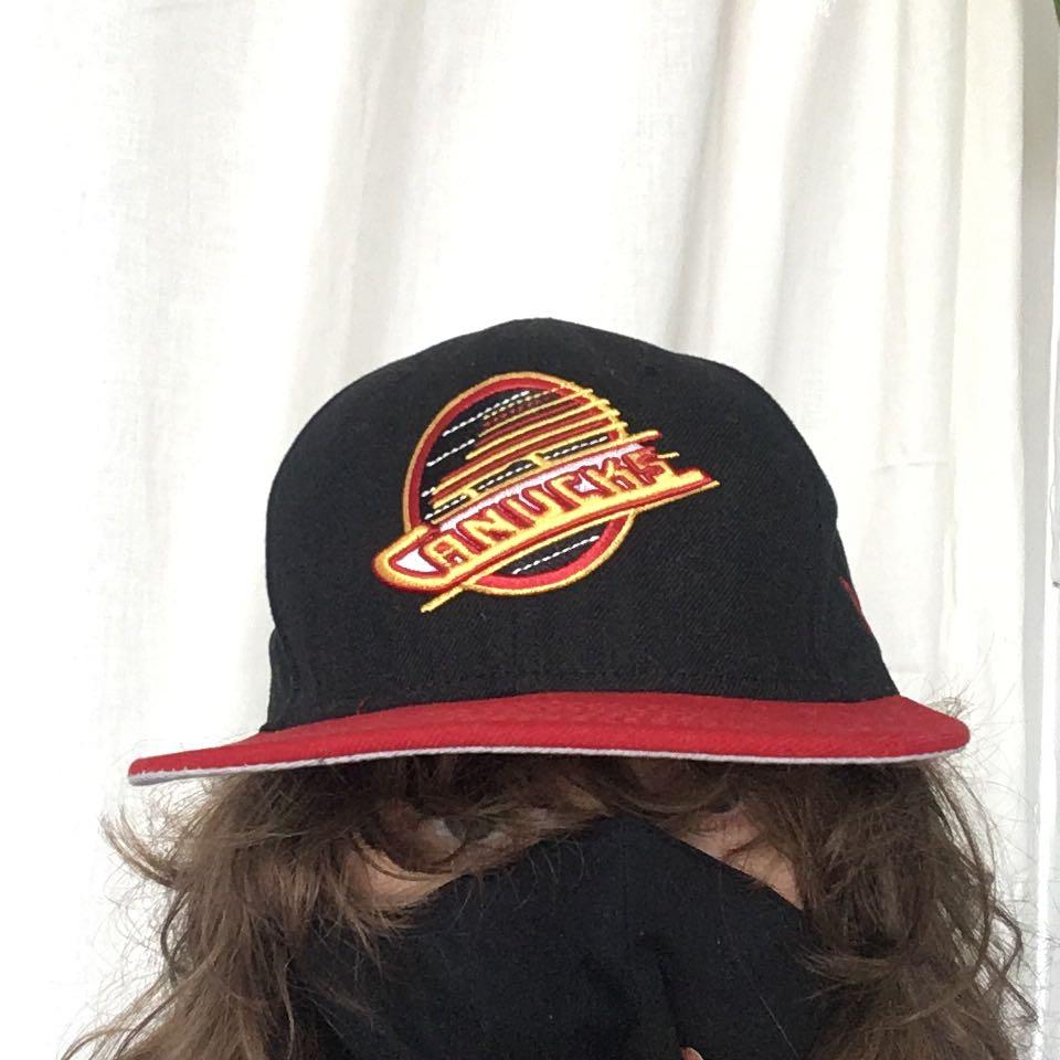 New era canucks shop hat