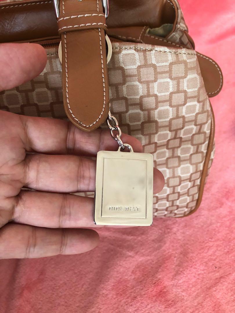 SALE!!! Authentic Nine West Bag (Category: Purses & Pouches) located in Bulacan. Submitted by le_verne (Listing ID 1068897996, Image 2). Description: Printed fabric color cream and light brown leather handles. .