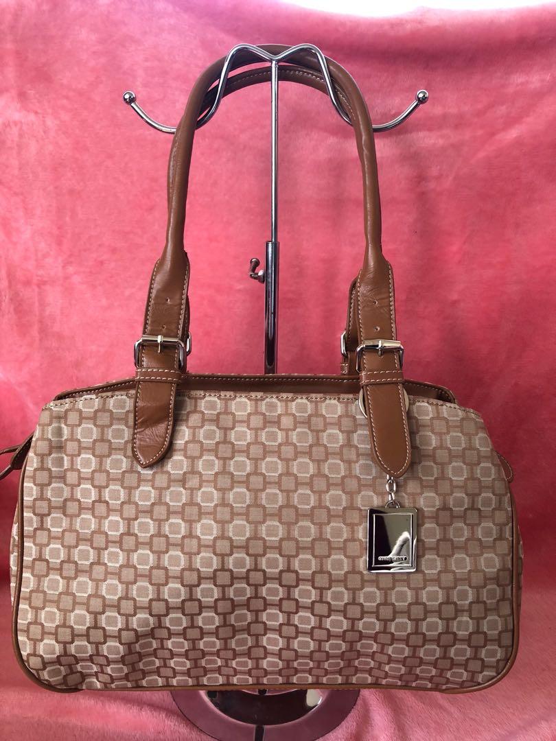 SALE!!! Authentic Nine West Bag (Category: Purses & Pouches) located in Bulacan. Submitted by le_verne (Listing ID 1068897996, Image 1). Description: Printed fabric color cream and light brown leather handles. .