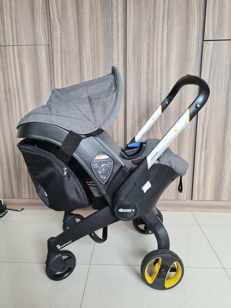 WTS Doona with carrier and car seat protector, Babies & Kids, Going