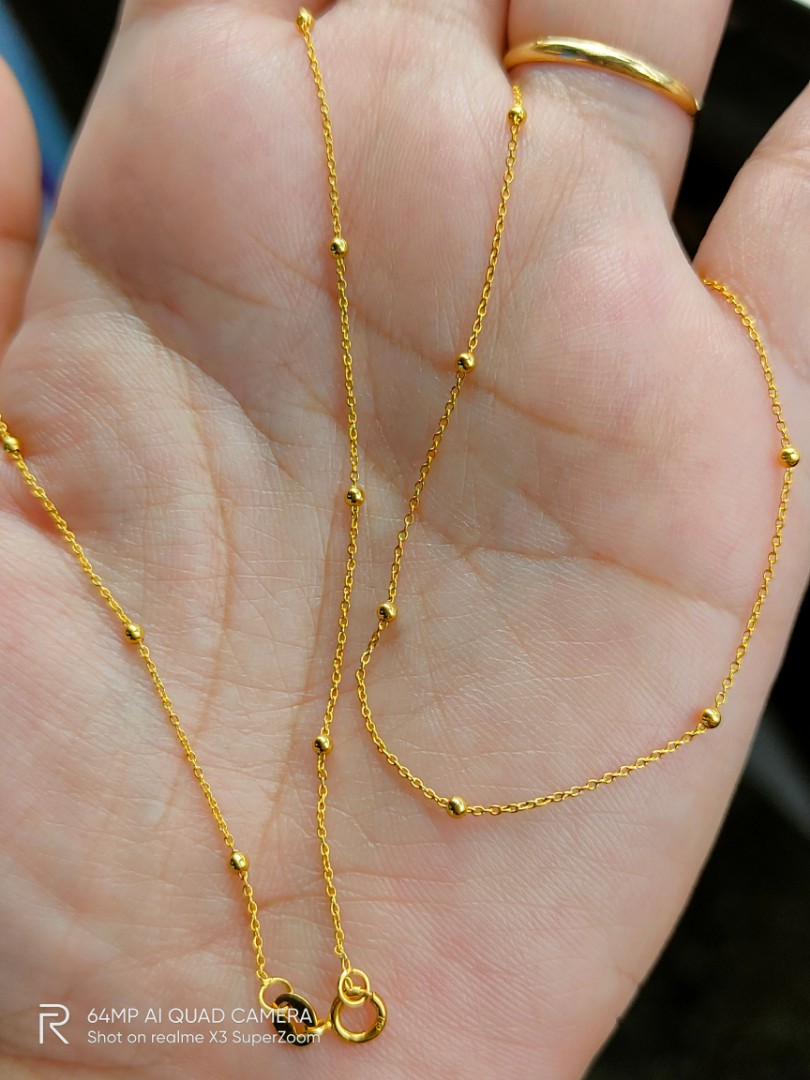 Gold ball station best sale necklace