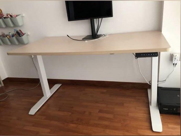 Height adjustable table (Category: Tables & Sets) located in Singapore. Submitted by wearthepants (Listing ID 1069372025, Image 1). Description: - 1+ year old, - Lightly used, - Minor scuffs on table leg - Table size- 140x70cm - Quiet dual motor with 4 memory height selection (similar to omnidesk) - Great for WFH setup Selling as moving to new house soon and wife thinks will not suit room design. Feel free to test table motor before purchase. Buy