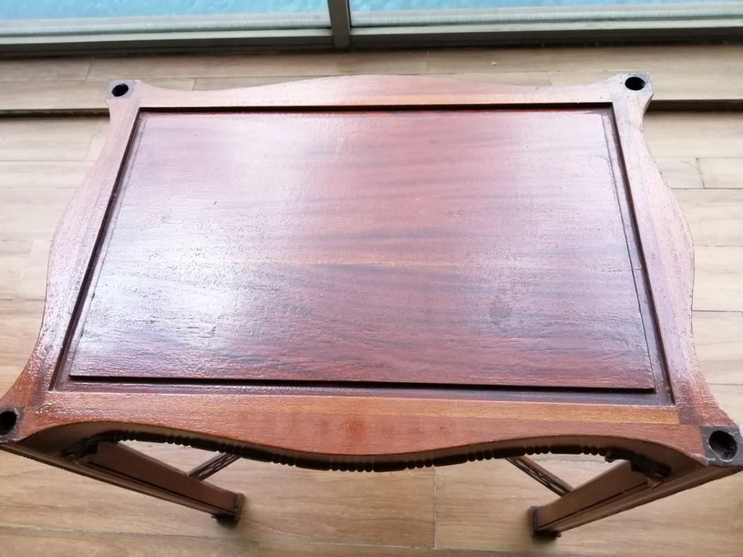 Teak side table (Category: Tables & Sets) located in Singapore. Submitted by cavendish (Listing ID 1069379014, Image 3). Description: Teak side table with Indonesian details at the base W58cm D40cm H62cm Some water stains on the top, can be varnished over..