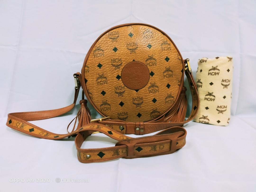 Mcm round sling bag online