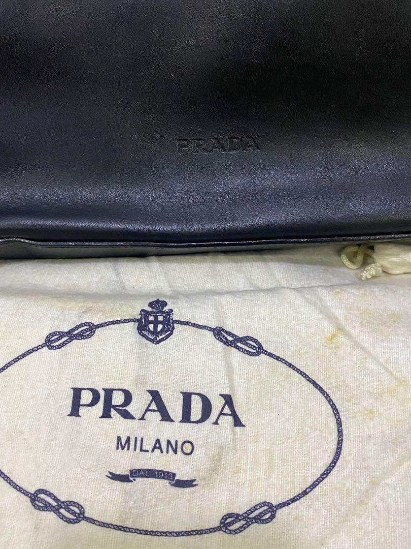 Authentic PRADA Black Leather Bag Purse Medium sized Tote (Category: Luxury Bags & Wallets) located in Mandaluyong City. Submitted by disney101618 (Listing ID 1069680292, Image 2). Description: Selling this purse that was purchased in Spain. Black Leather with lock Authentic Prada, comes with original DustBag.