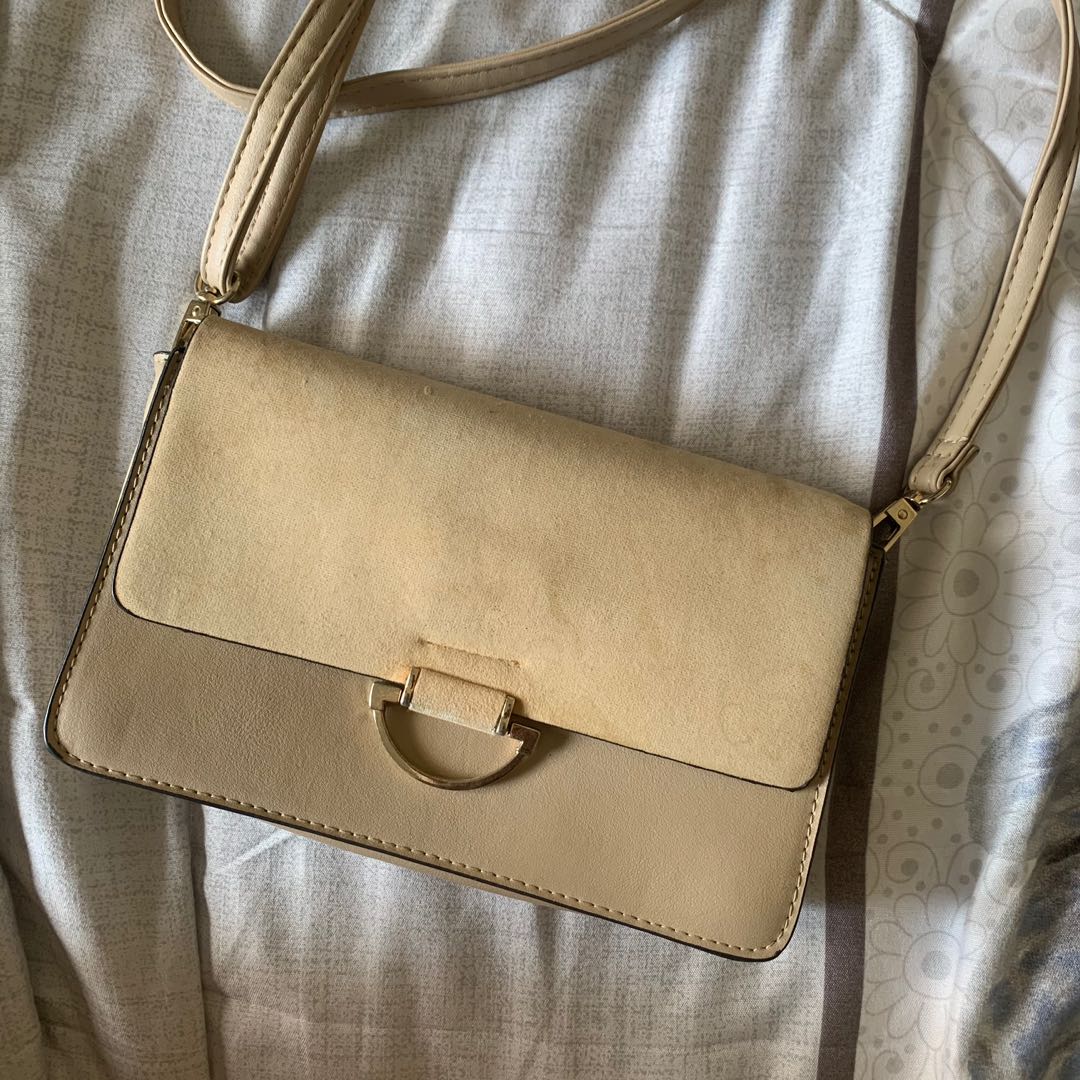 beige sling bag