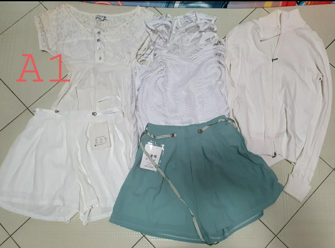 Bundle A1 (Category: Other Tops) located in Singapore. Submitted by sushiwu (Listing ID 1069511977, Image 1). Description: To be sold as a bundle. $10 only, non negotiable. clearing out my wardrobe. some used, some new. will fit size small and medium not for fussy buyers. self collection only. location to be advised..