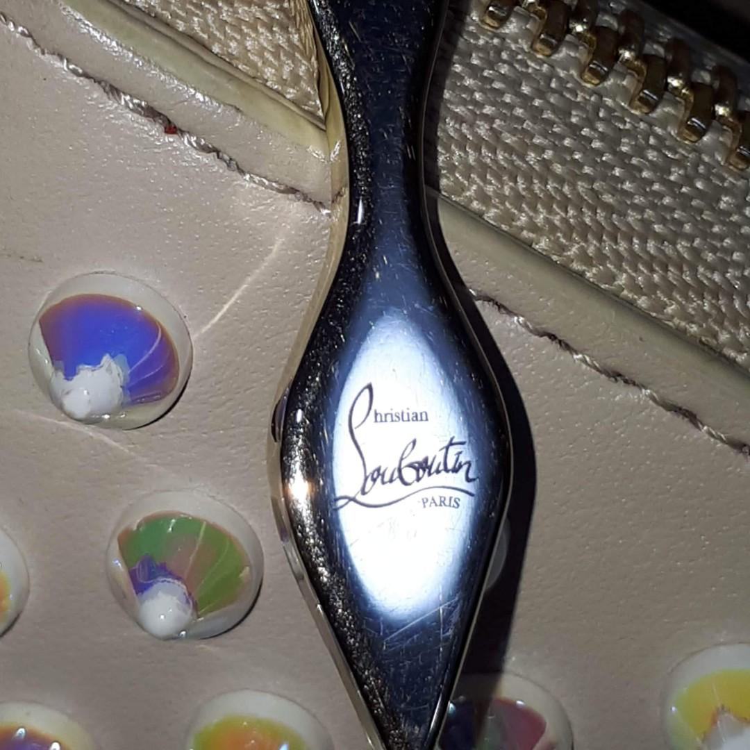 Christian Louboutin Ivory Panettone Wallet (Category: Luxury Bags & Wallets) located in Taguig. Submitted by esa.agustin (Listing ID 1069677544, Image 3). Description: Original Christian Louboutin Pannetone wallet. Complete inclusion - box, dust bag, carecard and authenticity card. Made in Italy..