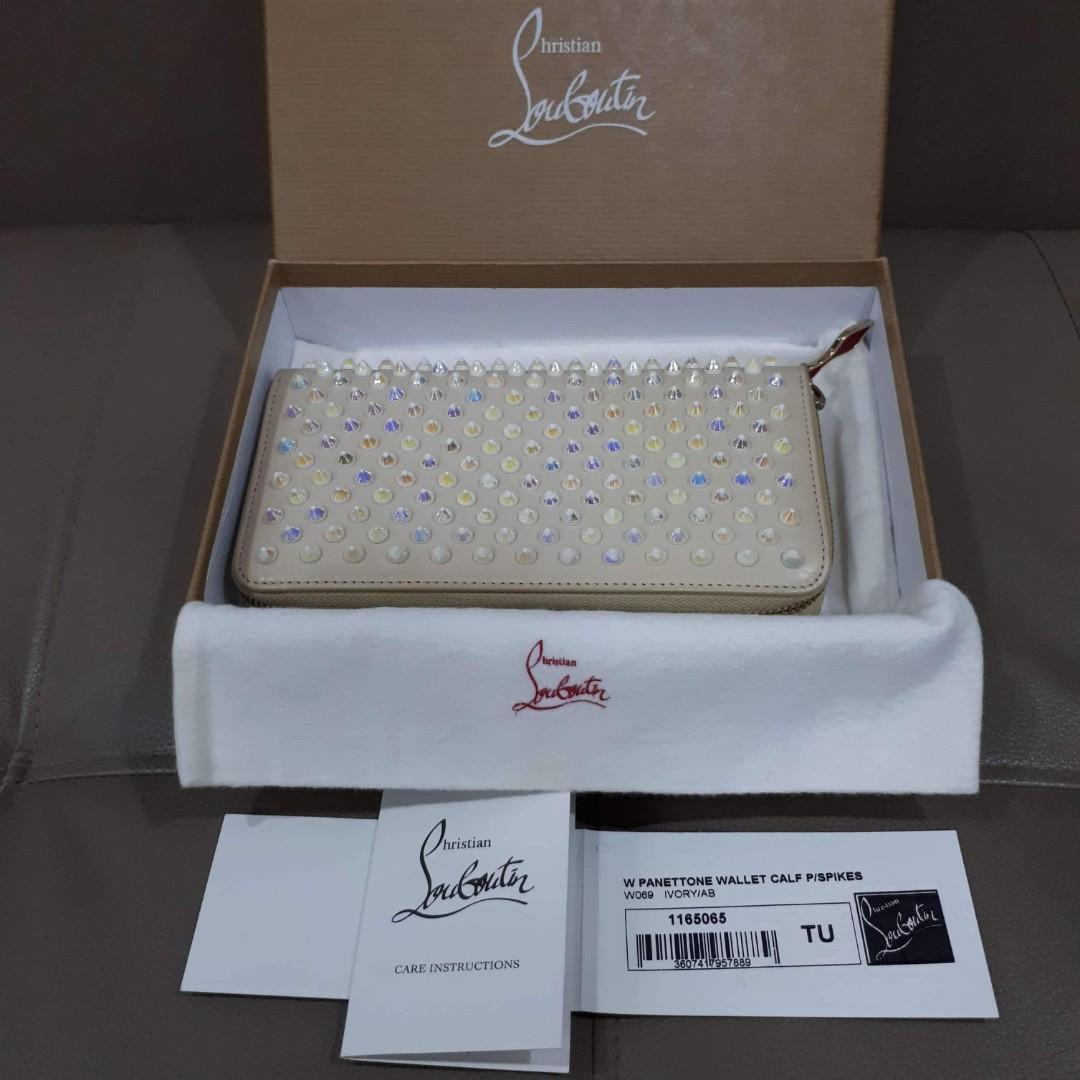 Christian Louboutin Ivory Panettone Wallet (Category: Luxury Bags & Wallets) located in Taguig. Submitted by esa.agustin (Listing ID 1069677544, Image 1). Description: Original Christian Louboutin Pannetone wallet. Complete inclusion - box, dust bag, carecard and authenticity card. Made in Italy..