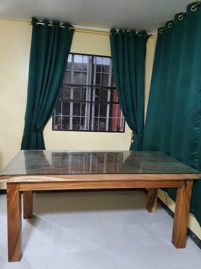 8 seater table (Category: Sofas) located in Cabuyao City. Submitted by bmg32 (Listing ID 1069618797, Image 1). Description: solid wood 8 seater table w/ glass at 8 pcs chairs its too big for my dining room, swap is available sa 6 seater circle or rectangle table pick up cabuyao laguna.