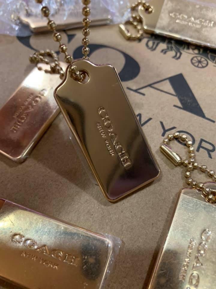 Coach gold metal hang tag cheap