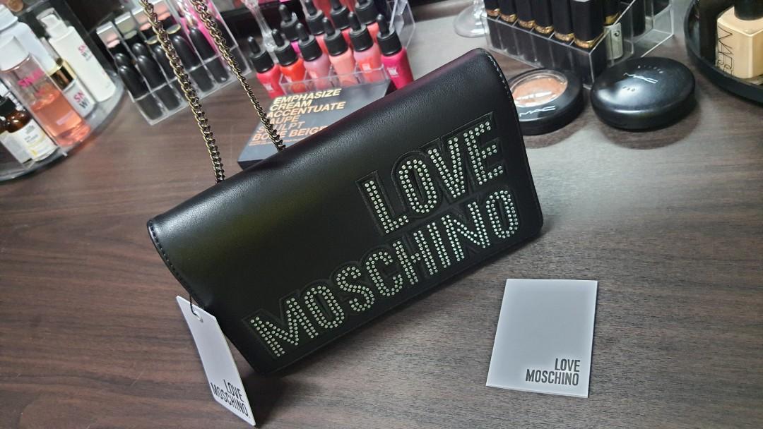 Love Moschino classic crossbody authentic (Category: Luxury Bags & Wallets) located in Subic. Submitted by saybyetofelicia (Listing ID 1069770786, Image 3). Description: love moschino with tag chain crossbody silver with dustbag can be used as clutch.