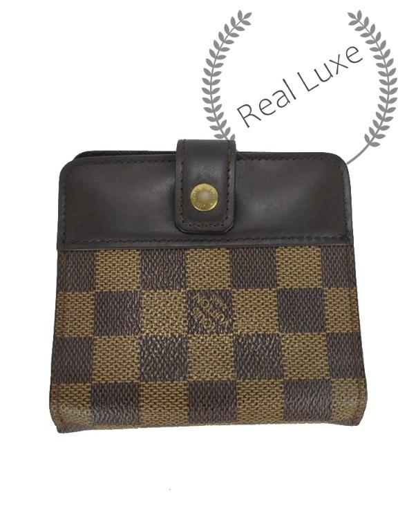 Authentic LOUIS VUITTON damier bifold compact wallet (Category: Luxury Bags & Wallets) located in Cagayan de Oro. Submitted by real_luxe (Listing ID 1070252634, Image 2). Description: Flaw: Minor tear With Dustbag "PLEASE TAKE A CLOSER LOOK ON THE FLAWS" The Photos are taken by "US" and water mark on all images to avoid people taking our hard work. We take a lot of photos already with good quality, so hoping you wont ask for more as my time is ve