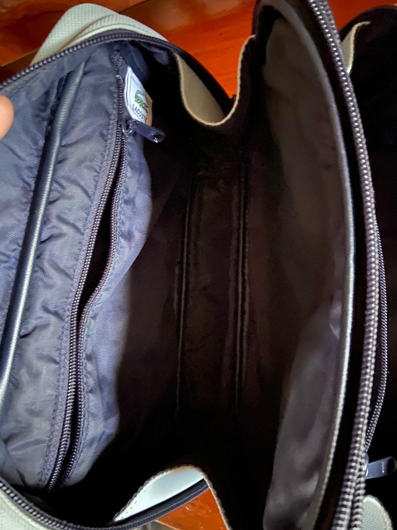 Lacoste Handbag ( authentic/ original) (Category: Luxury Bags & Wallets) located in Angono. Submitted by dolcevita_12 (Listing ID 1070295261, Image 3). Description: 100% Original Lacoste handbag No major flaws Inside & out is clean Measurement: L 9" x H 5.5 " width is expandable with multiple compartments .