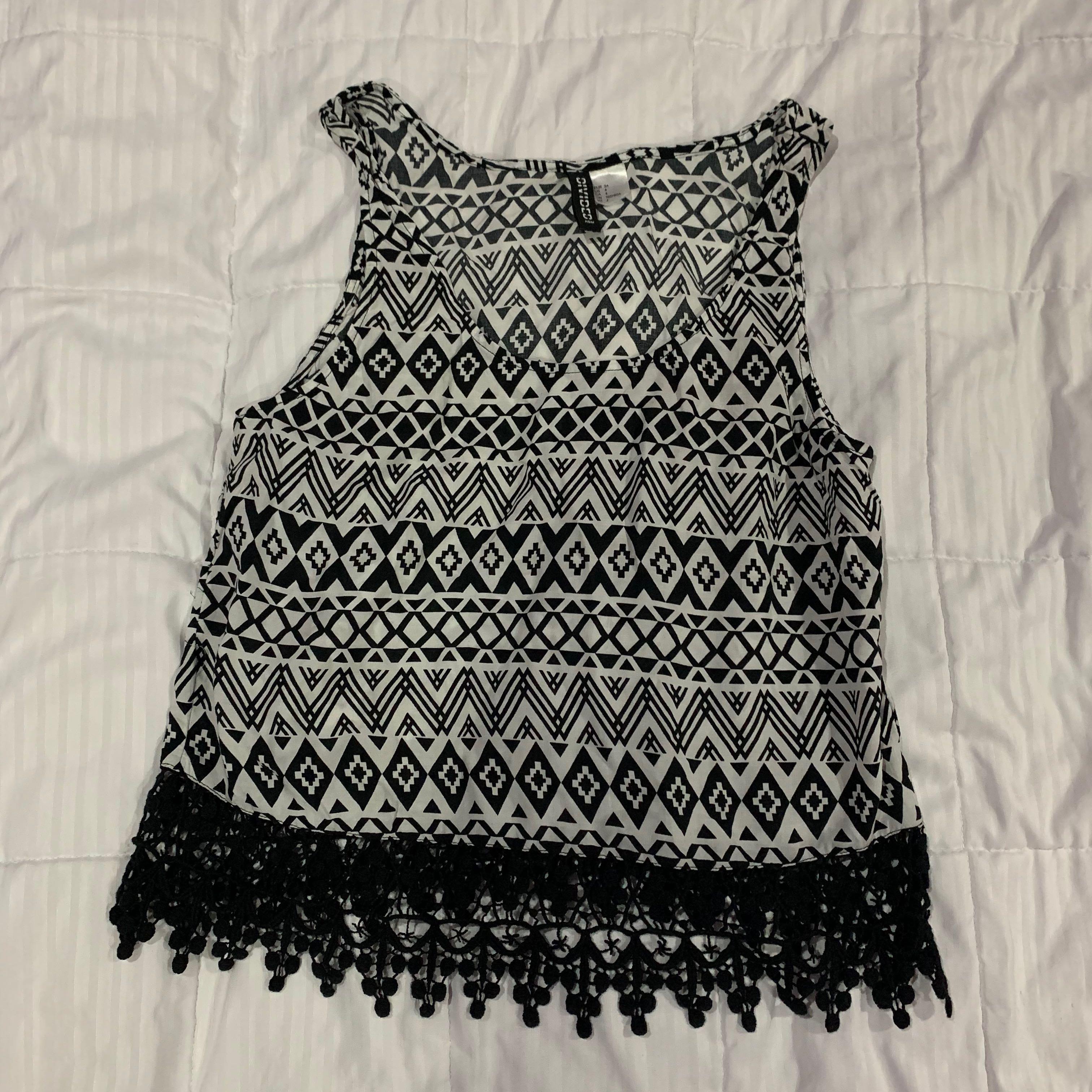 H&M Black and White Top (Category: Others Tops) located in Pasig City. Submitted by ysabeldc (Listing ID 1067001154, Image 1). Description: Used once. Mint condition Tags: beach top, y2k, tribal, aztec.