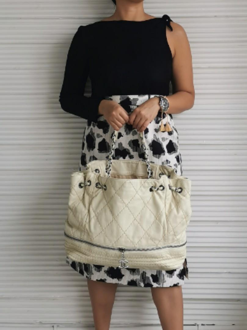 Authentic Preowned CHANEL Beige Wild Stitch Expandable Drawstring Chain Tote Bag (Category: Luxury Bags & Wallets) located in San Pablo. Submitted by watchyouwantphsecond (Listing ID 1070608782, Image 1). Description: Authentic Preowned C H A N E L Beige Wild Stitch Expandable Drawstring Chain Tote Bag No Inclusion Interior 8.9/10 Exterior 8.9/10 Strap 8.9/10 Hardware 8.9/10 P50,000 FREE SHIPPING Open For Layaway Credit Card Accepted Cash On Deli