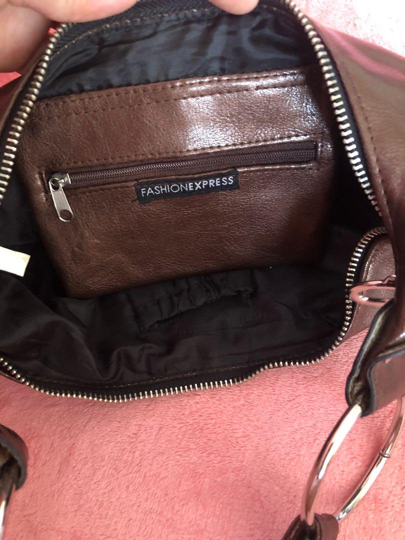 Fashion Express Baguette (Category: Shoulder Bags) located in Bulacan. Submitted by le_verne (Listing ID 1070572630, Image 2). Description: Bronze in color. Faux leather. Glossy outer and fabric inner lining. .