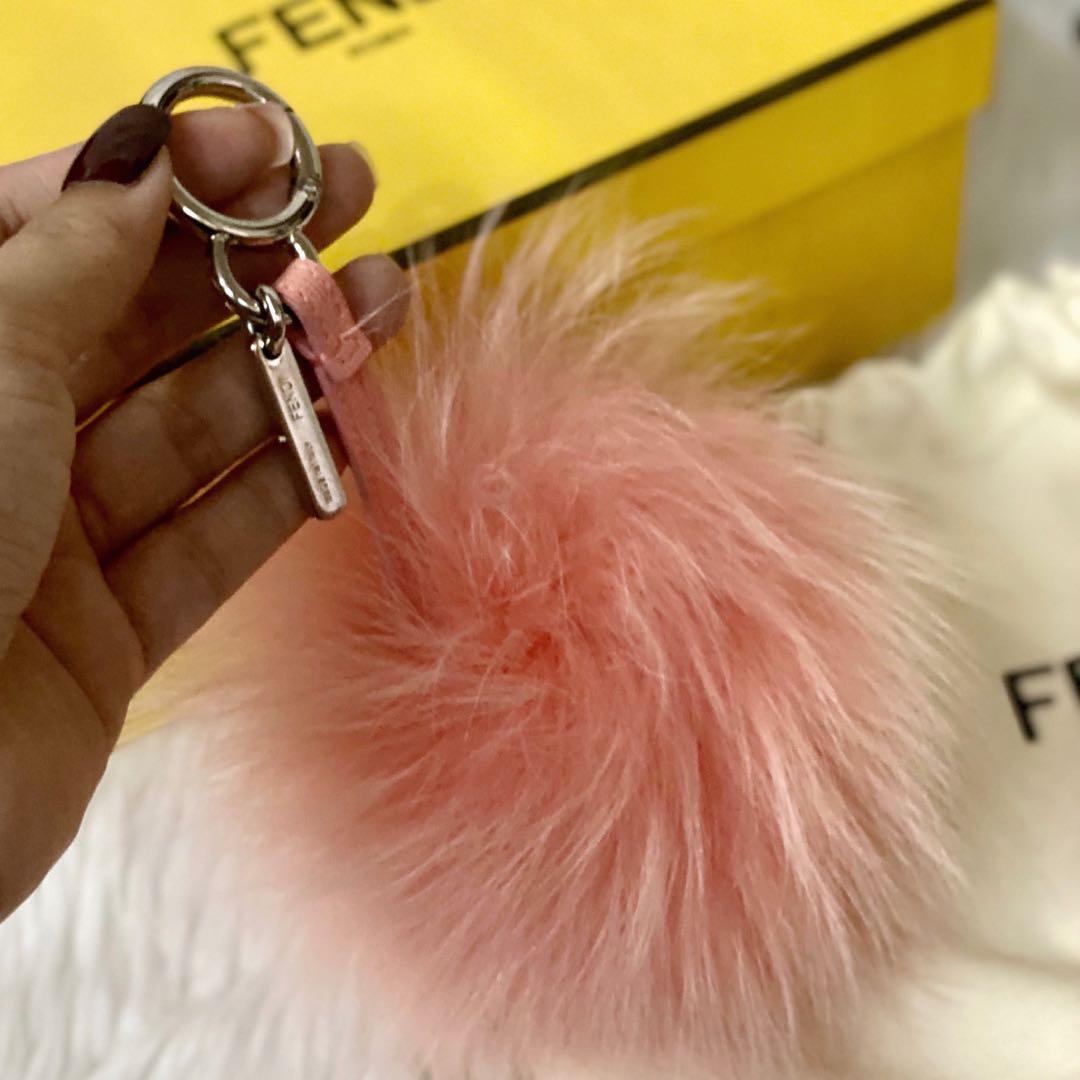 Fendi Pom Pom Bag Charm (Category: Luxury Accessories) located in Pasig City. Submitted by thecruzescloset (Listing ID 1071190786, Image 2). Description: Fendi Pom Pom Bag Charm Peach Dyed Shadow Fox Fur. Polished silvertone logo charm. Peach colored lamb leather charm strap. Polished silvertone key-ring clip. 9” total length, 3” strap drop (approximately) Condition: Excellent - barely used. Good as new. Inclusions: Dust bag and Box Bought in Par