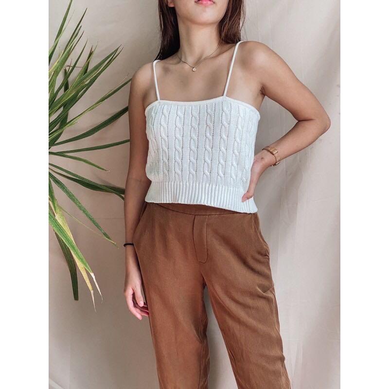 Trendy design twist knitted cami top (Category: Others Tops) located in Cebu City. Submitted by lavitify (Listing ID 1071251772, Image 3). Description: Brand new and onhand stocks Model is wearing freesize Model dimension: 42.8kg / 5ft / 25in waist Available colors: Black , white Refer to last photo for size chart(cm) ~ knitted material very soft .