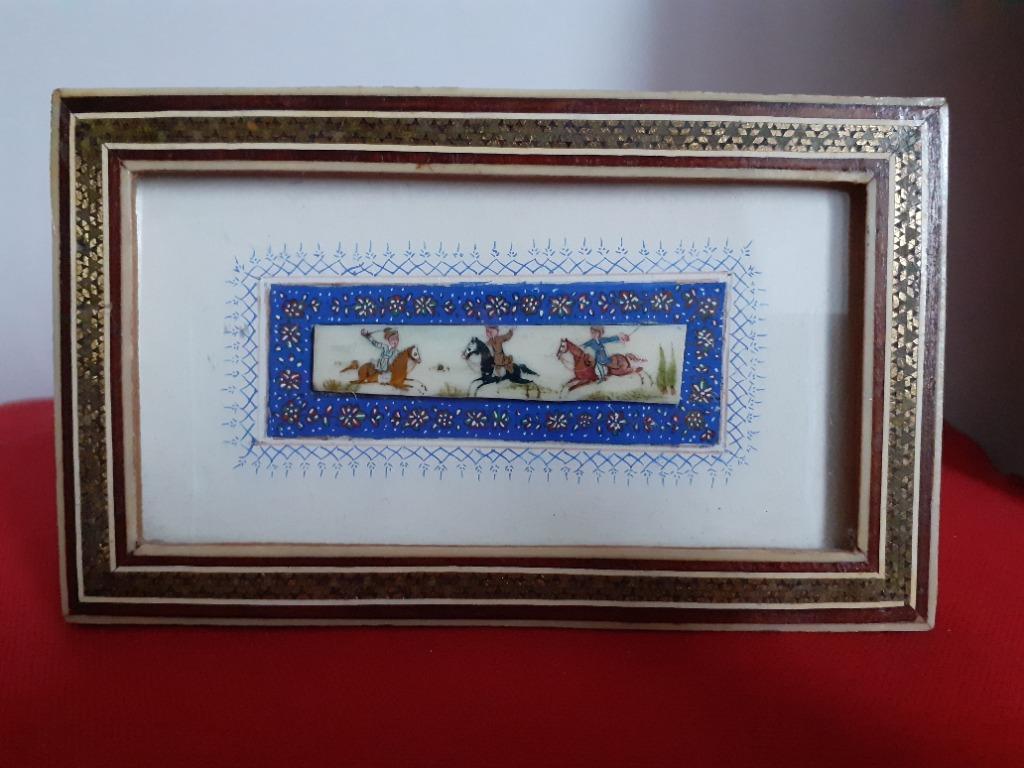Persian Painting on Bone (Category: Wall Decor) located in Paranaque City. Submitted by donjuan_thegreat (Listing ID 1071714156, Image 1). Description: In very good vintage condition Persian Suratgari miniature painting on Bone Khatam is also the capital of Khatam County in Iran. Common materials used in Khatam Kari are inlaid gold, silver, brass, aluminum, and twisted wire. Dimensions: Frame: L 15 cm, H 9 cm Painting on bone: L 6.5 cm, H 1.3 cm 