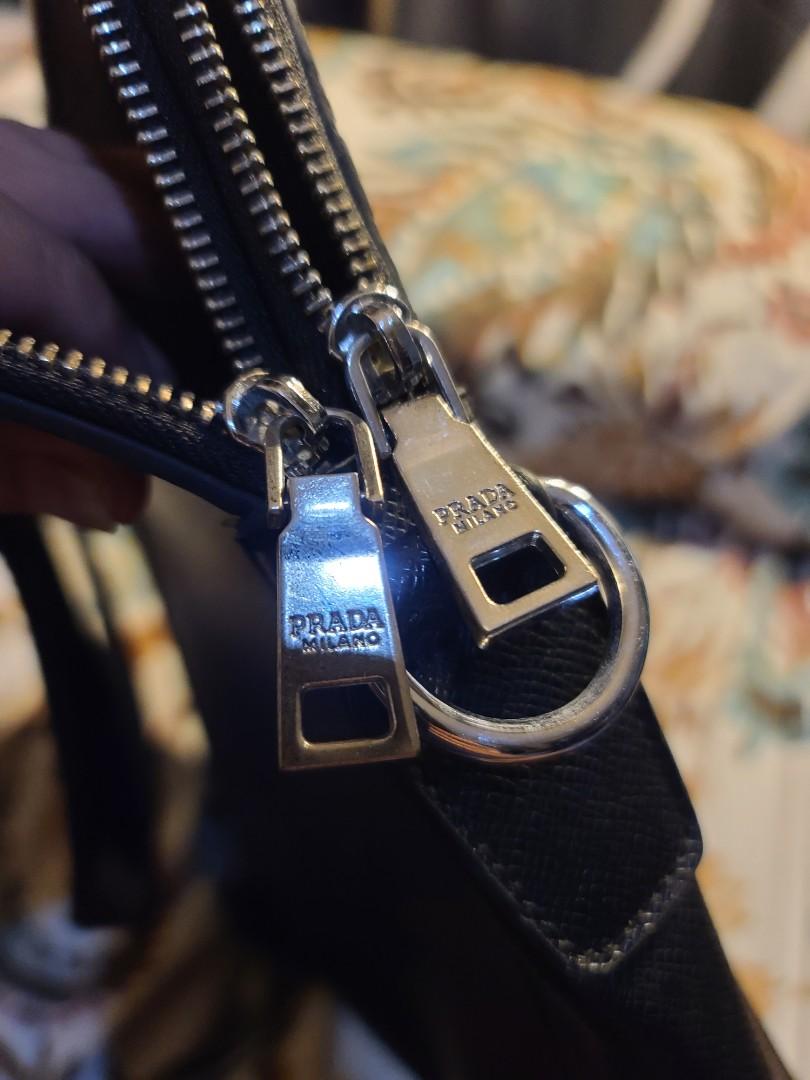 PRADA DOCUMENT BAG free SF (Category: Luxury Bags & Wallets) located in Manila. Submitted by shoppingspree008 (Listing ID 1071665104, Image 3). Description: Please manage your expectation as this is a preloved but the bag is still beautiful.Provision for sling but no sling included. Please see photos to appreciate. No return no exchange policy. FREE SF ALONG METRO Bundle price discount for 2 or more bag purchases.Posting will be updated once sold