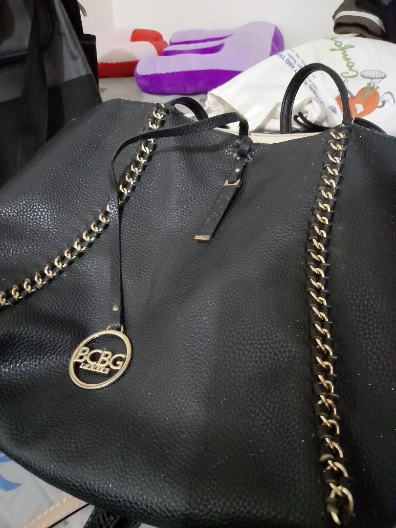 Rush! Auth BCBG Black Chain Tote! Selling low! (Category: Luxury Bags & Wallets) located in Quezon City. Submitted by all200andbelow (Listing ID 1071677324, Image 2). Description: rush rush rush! auth BCBG black leather chain tote! selling super low! with signs of usage, inside with pen marks. exterior clean with some scruffings. metal logo with some tarnish(see pics) still very usable and can be cleaned..