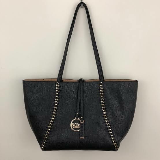 Rush! Auth BCBG Black Chain Tote! Selling low! (Category: Luxury Bags & Wallets) located in Quezon City. Submitted by all200andbelow (Listing ID 1071677324, Image 1). Description: rush rush rush! auth BCBG black leather chain tote! selling super low! with signs of usage, inside with pen marks. exterior clean with some scruffings. metal logo with some tarnish(see pics) still very usable and can be cleaned..