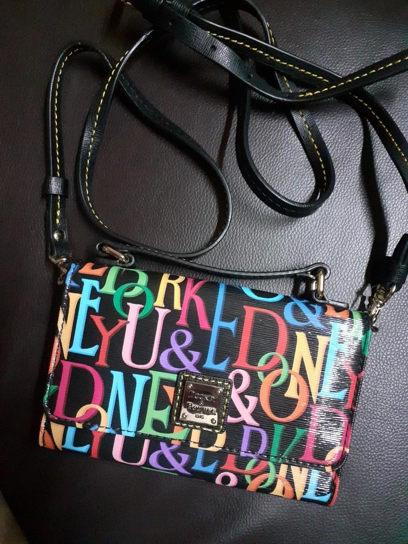 Authentic Brand New DB Sling Flip Wallet (Category: Purses & Pouches) located in Tarlac. Submitted by importedbranded (Listing ID 1071847811, Image 1). Description: Authentic and brand new Still in very good condition Metal buckets are still gold No scratch or anything THIS IS JUST LIKE A WALLET WITH Strap. No much space inside. 6.5 inches by 4.5 inches.