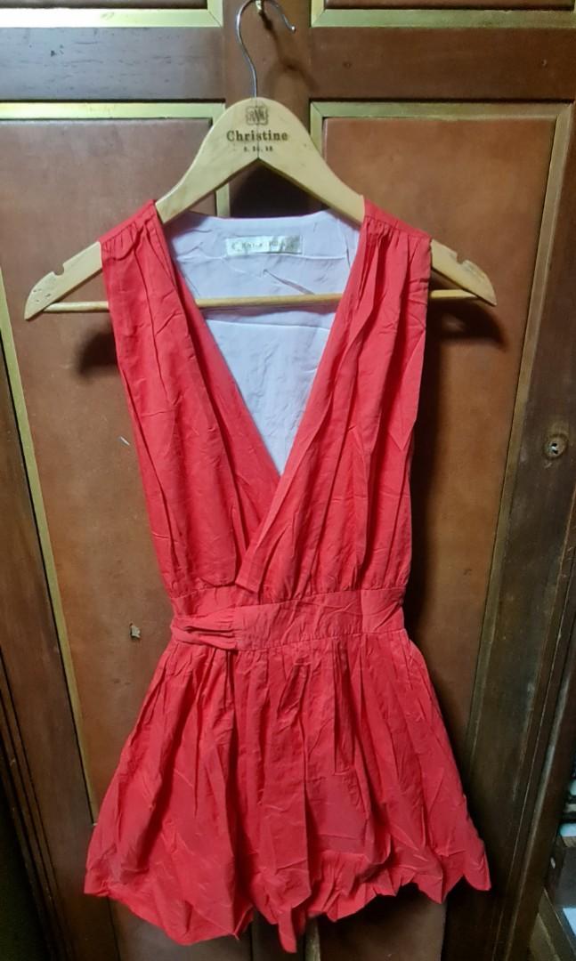Wrap around red dress (Category: Dresses) located in Pasig City. Submitted by xtnter (Listing ID 1071731238, Image 1). Description: Sorry ddnt iron my clothes 😁 just want to have a lil space in my cabinet. msg me if u want to know more bout the item. not really good on describing them.😊.