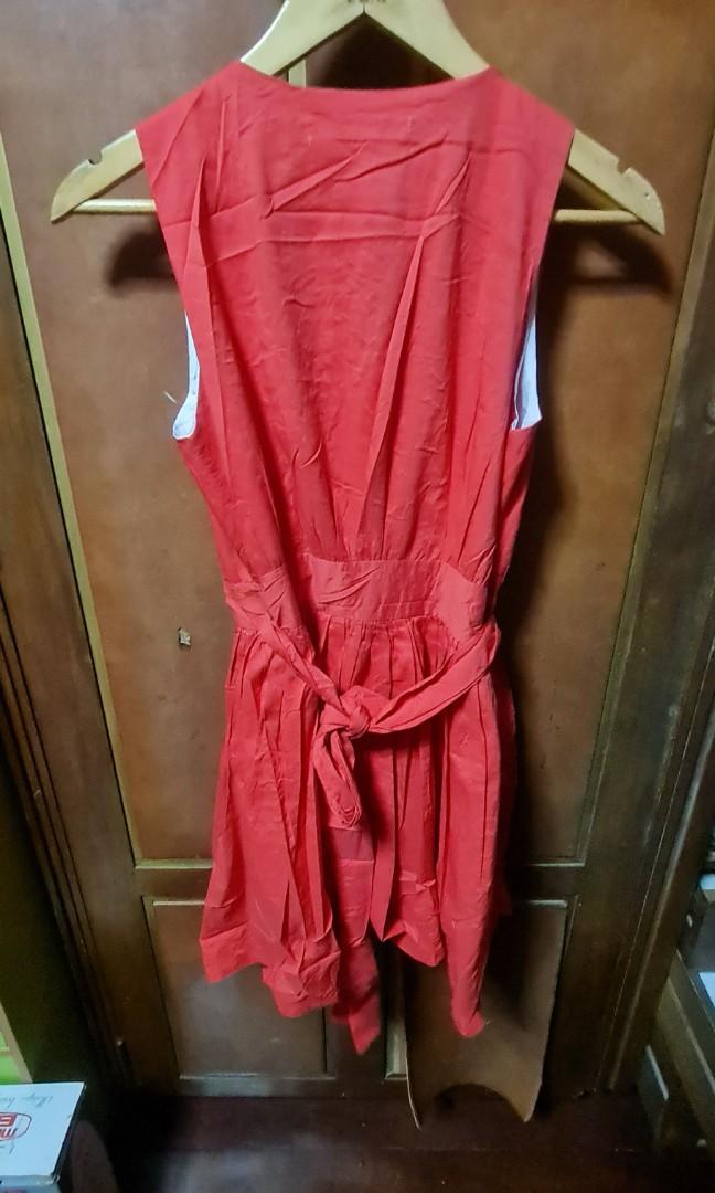 Wrap around red dress (Category: Dresses) located in Pasig City. Submitted by xtnter (Listing ID 1071731238, Image 2). Description: Sorry ddnt iron my clothes 😁 just want to have a lil space in my cabinet. msg me if u want to know more bout the item. not really good on describing them.😊.