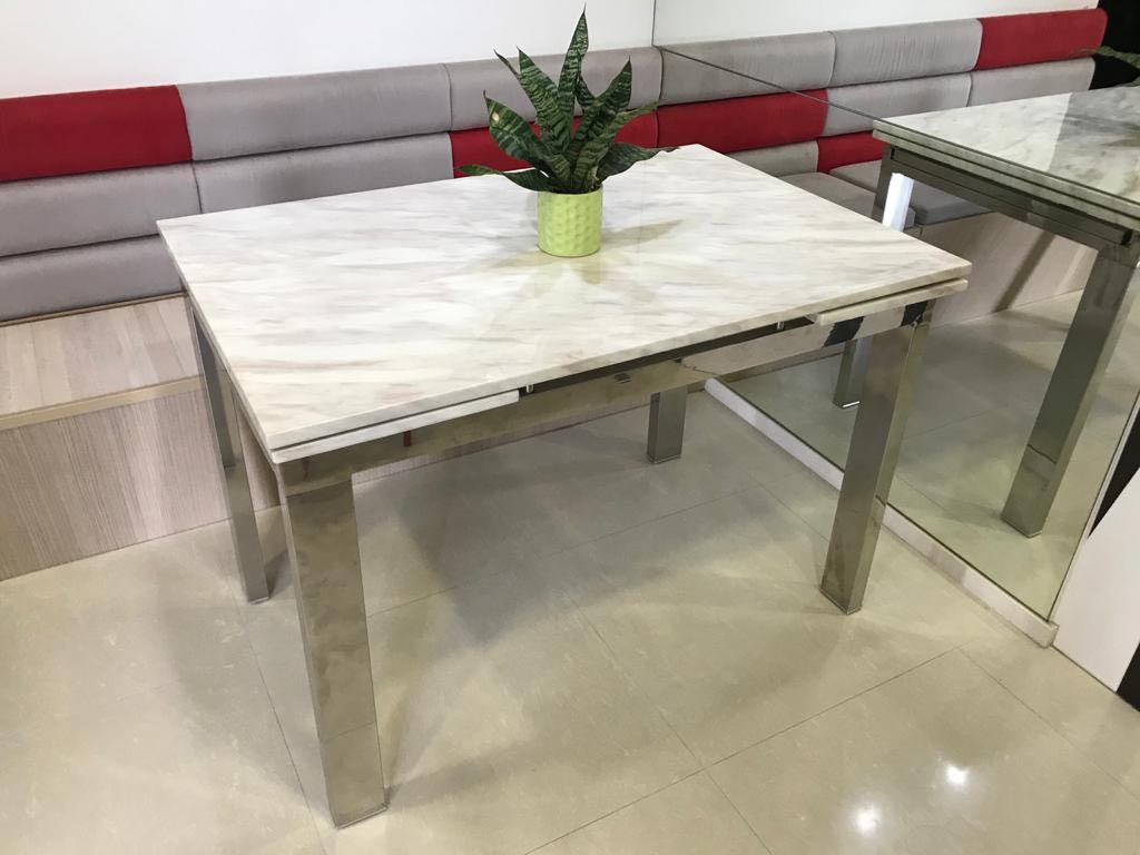 Dining Table (Category: Tables & Sets) located in Singapore. Submitted by sajgno (Listing ID 1072135016, Image 1). Description: Cultured marble top with stainless frame in good condition. Solid marble top and heavy. Height: 77cm Width: 74cm Length: 110cm + 30cm extendable on each side. 170cm when fully extended Bought the whole set - 1 table and 2 chairs - at $900. Letting go of the table at a cheap rate! Chairs are damaged and therefore not sell