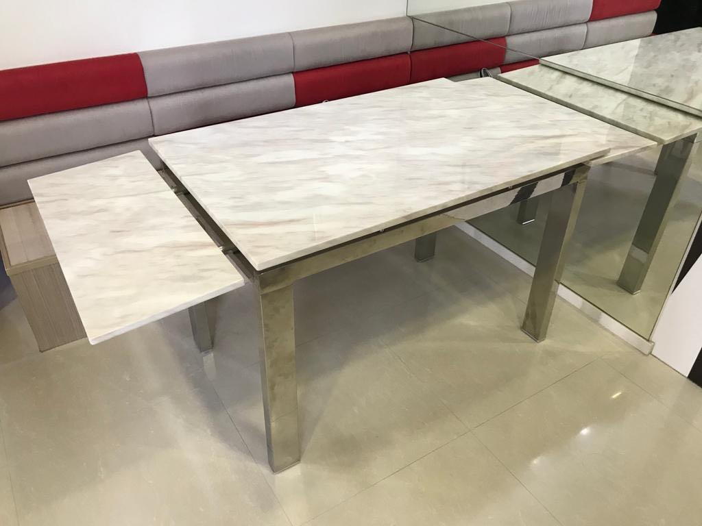 Dining Table (Category: Tables & Sets) located in Singapore. Submitted by sajgno (Listing ID 1072135016, Image 3). Description: Cultured marble top with stainless frame in good condition. Solid marble top and heavy. Height: 77cm Width: 74cm Length: 110cm + 30cm extendable on each side. 170cm when fully extended Bought the whole set - 1 table and 2 chairs - at $900. Letting go of the table at a cheap rate! Chairs are damaged and therefore not sell