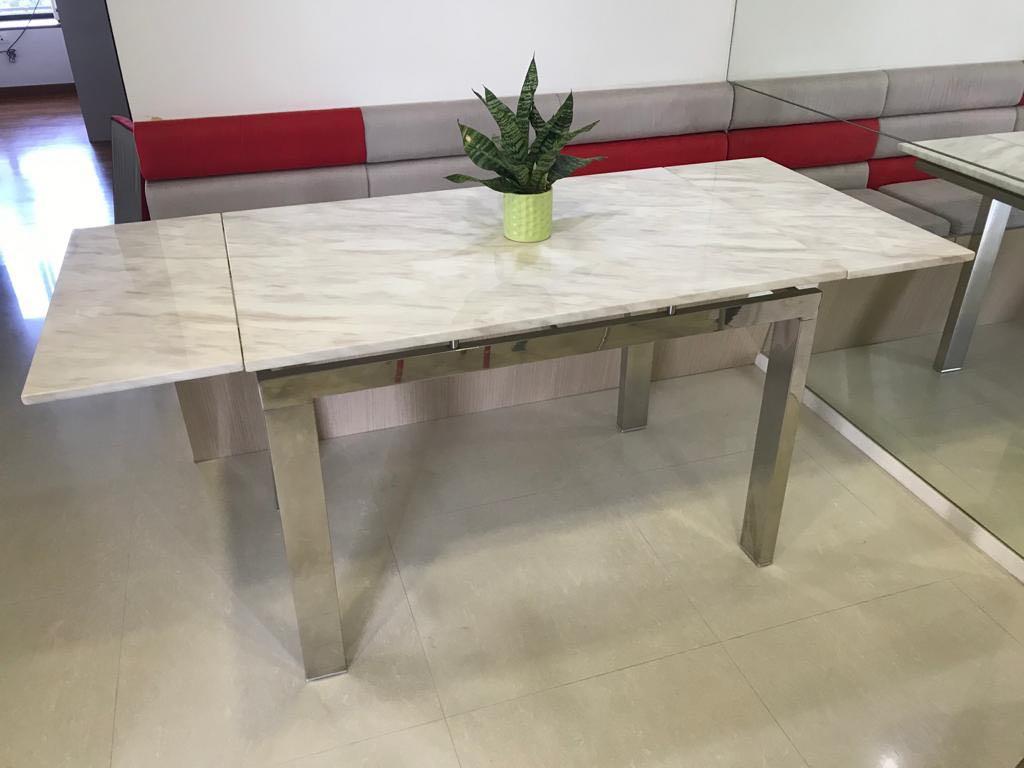 Dining Table (Category: Tables & Sets) located in Singapore. Submitted by sajgno (Listing ID 1072135016, Image 2). Description: Cultured marble top with stainless frame in good condition. Solid marble top and heavy. Height: 77cm Width: 74cm Length: 110cm + 30cm extendable on each side. 170cm when fully extended Bought the whole set - 1 table and 2 chairs - at $900. Letting go of the table at a cheap rate! Chairs are damaged and therefore not sell