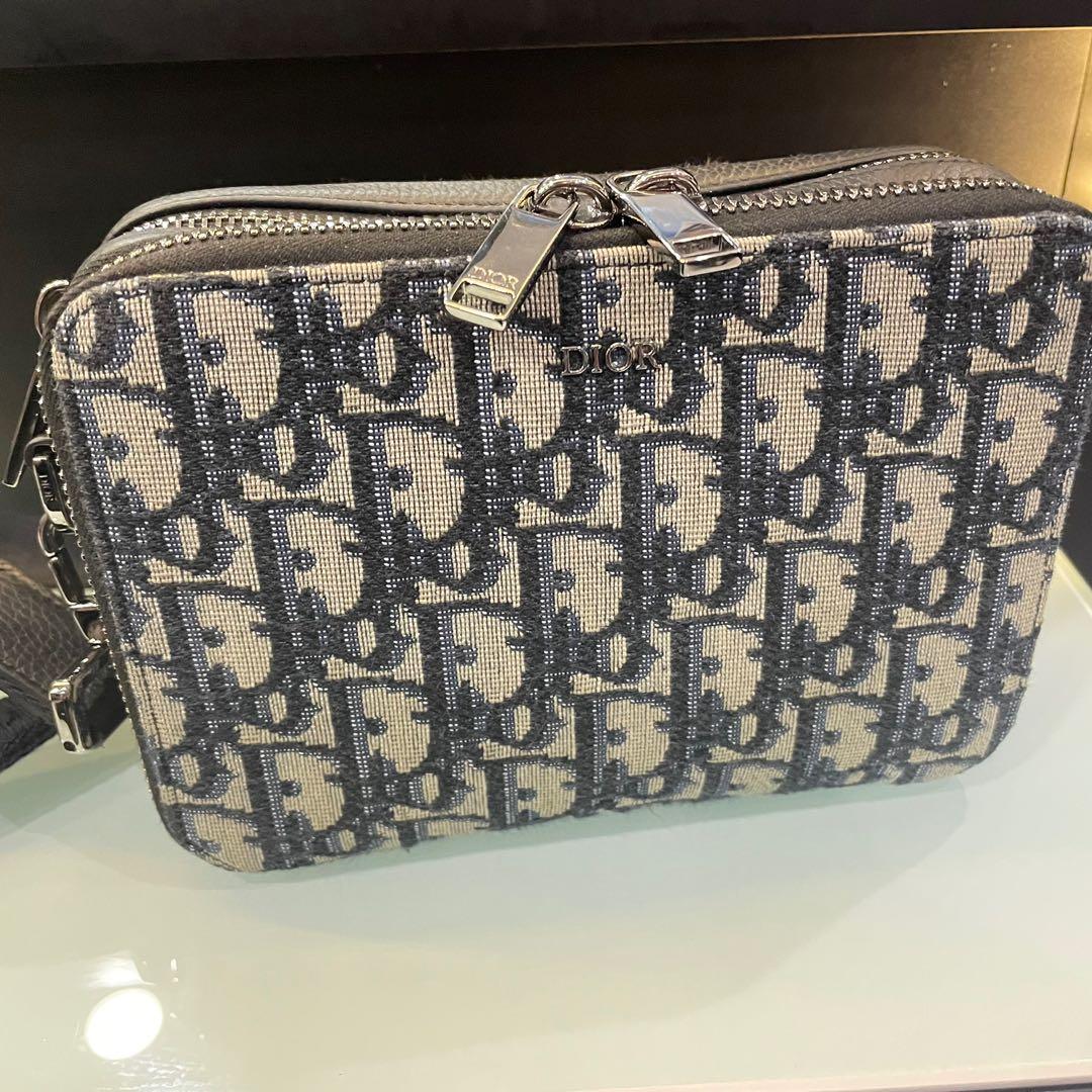 Authentic Dior Oblique Jacquard Vertical Lock Pouch with Strap, Luxury, Bags  & Wallets on Carousell