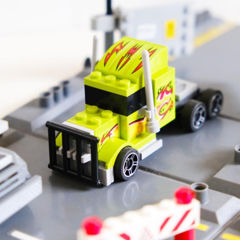 LEGO Racers Security Smash 8199 (Category: Lego & Building Sets) located in Binan City. Submitted by bargainsonblock12 (Listing ID 1067201163, Image 3). Description: Retired Lego set. Unfold the case and get ready to race and chase. Features opening gate and street construction fence. Security van includes opening door with compartment to store money and a cool gangster truck. Combine with other LEGO Racers fold-out sets to build the ultimate rac