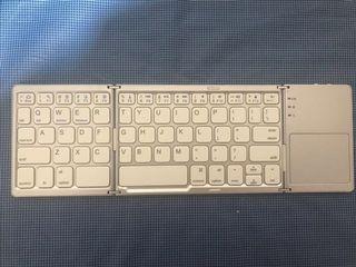 Portable bluetooth keyboard with touchpad