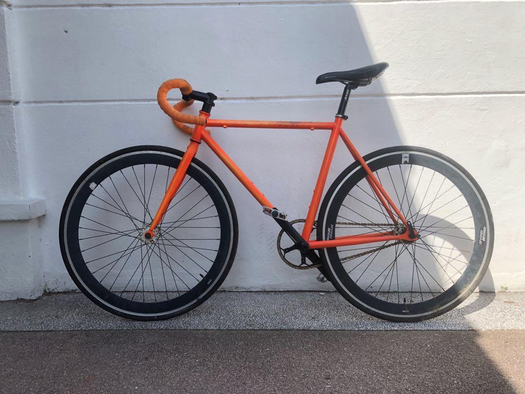 Orange fixed gear bike store