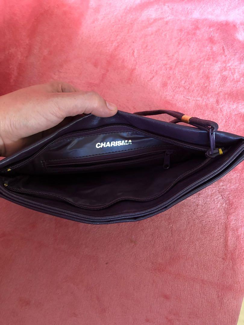 SALE!!! Charisma Clutch Bag (Category: Clutches) located in Bulacan. Submitted by le_verne (Listing ID 1068080568, Image 2). Description: Purple colored clutch bag from U.S. Multiple compartments. Last price. No haggling please. Need to buy my parent's medication and other health needs..