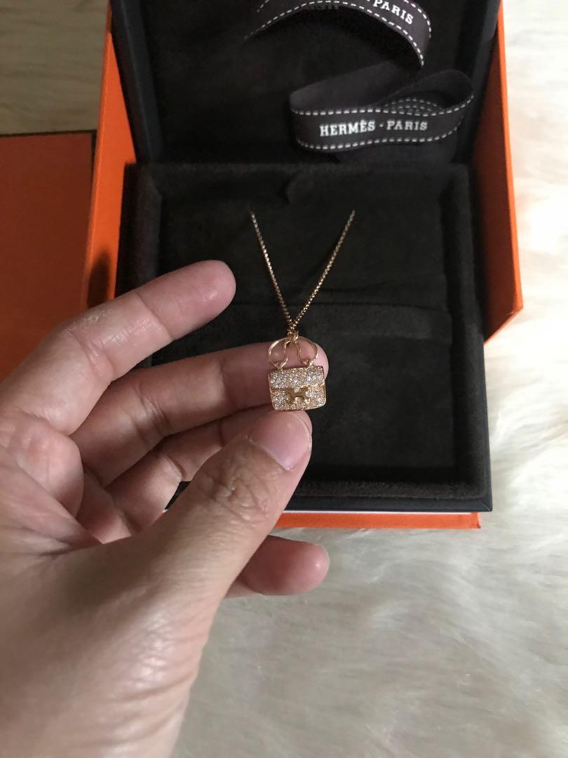Hermes Constance necklace (Category: Luxury Accessories) located in Makati City. Submitted by myterry1941 (Listing ID 1068145594, Image 2). Description: Used 2x only Hermes Constance amulet necklace With diamonds 18k Rose gold Complete with box and certificate .