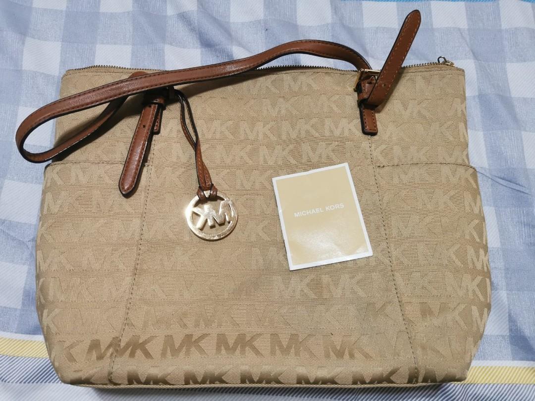 Original Michael Kors Bag with Leather straps (Category: Purses & Pouches) located in Antipolo. Submitted by G3AAA (Listing ID 1068016932, Image 1). Description: Used this only 2x. Very good condition no flaws. Good as new. RFS is to free up closet space..