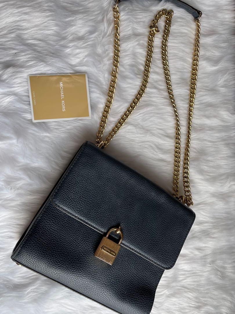 Original Micheal Kors sling bag (Category: Cross-body Bags) located in Makati City. Submitted by jen_000 (Listing ID 1068414588, Image 1). Description: Original Mk sling bag, with dust bag and care card. Got signs of usage .