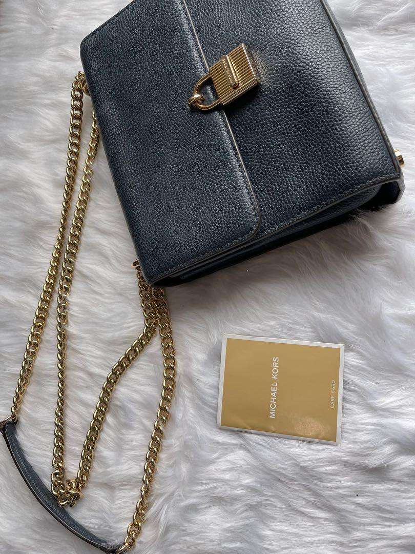 Original Micheal Kors sling bag (Category: Cross-body Bags) located in Makati City. Submitted by jen_000 (Listing ID 1068414588, Image 2). Description: Original Mk sling bag, with dust bag and care card. Got signs of usage .