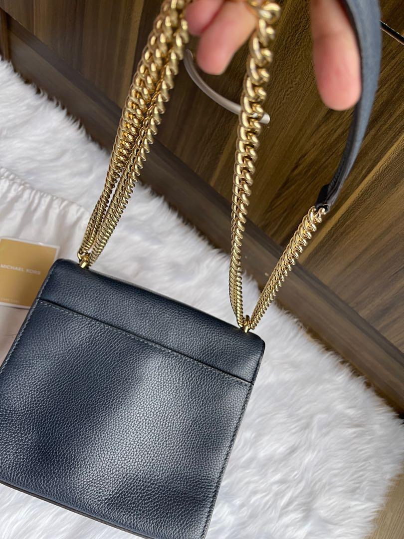 Original Micheal Kors sling bag (Category: Cross-body Bags) located in Makati City. Submitted by jen_000 (Listing ID 1068414588, Image 3). Description: Original Mk sling bag, with dust bag and care card. Got signs of usage .