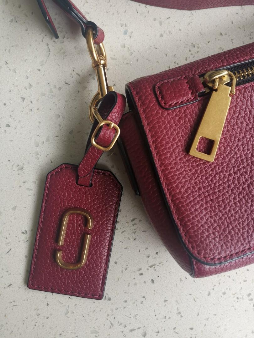 Marc Jacobs sling bag (Category: Luxury Bags & Wallets) located in Marikina City. Submitted by michelleaaa (Listing ID 1072343015, Image 2). Description: Authentic Marc Jacobs Maroon Gold hardware 8" length x 2" width x 5" height Genuine leather With dustbag Excellent condition Strap is detachable, can be replaced with a different or shorter one..