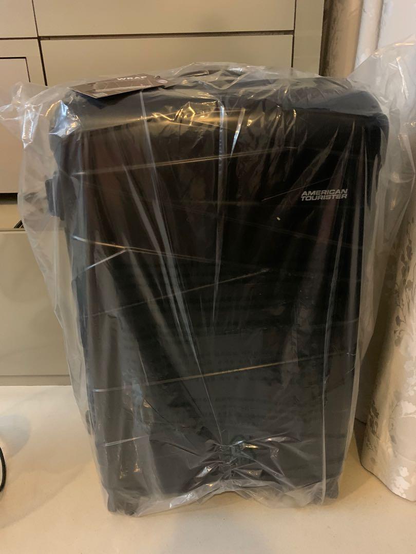 American tourister wrap 29 spinner luggage Hobbies Toys Travel Luggage on Carousell